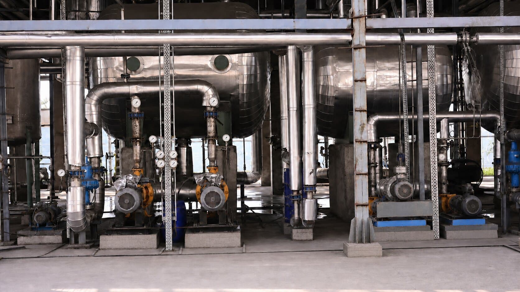 Stainless distillation columns and pipework inside the Inland Green Energy ethanol distillery.
