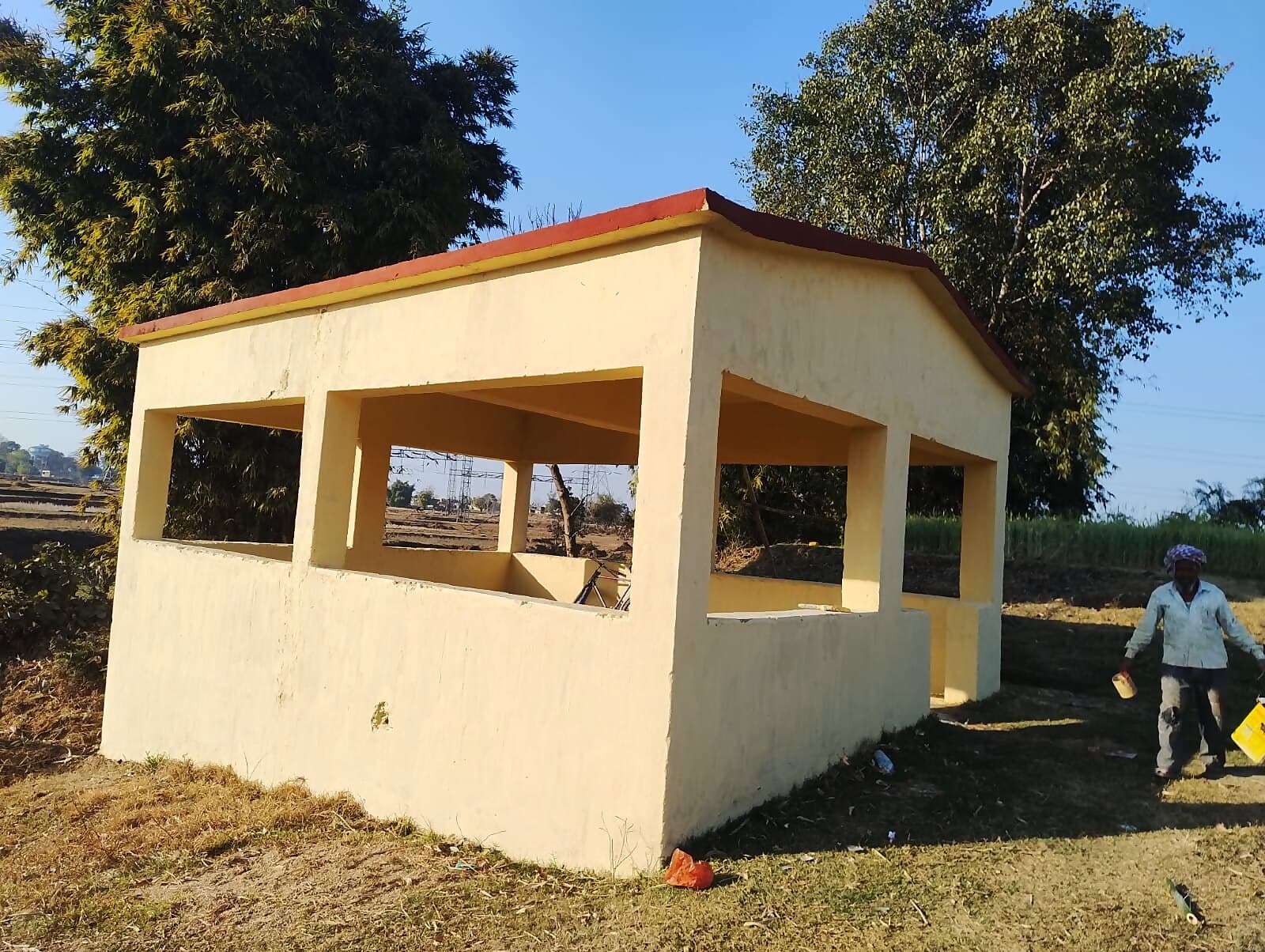 The freshly repaired and repainted cremation-ground shed at Serengatu village, renovated under Inland Power's CSR programme.